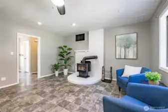 Family Room looking towards hall to entry, 1/2 bath and laundry and garage
