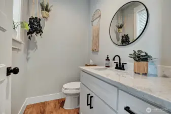 Guest half-bath, this space feels both stylish and welcoming.
