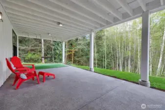 This substantial covered space offers protection from the elements, allowing you to savor the fresh air and connect with your surroundings regardless of the weather. Wired for hot tub.