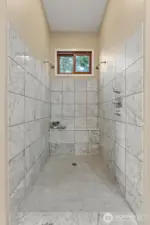 Main floor primary walk-in shower