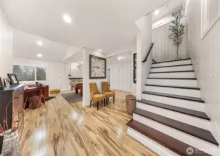 Lets step down these custom made stairs to the second living space; the "game room".