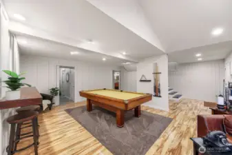 Looking back towards the stairs to the main upper floor. The door on the left leads to the large mudroom (access to the oversized two car garage) and the large laundry room complete with ample cabinets and a laundry chute from the primary bedroom.