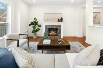 Open concept living area with gas fireplace.