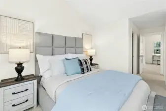 Primary suite includes walk-in closets, and private bath.