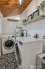 Laundry room with new paint, flooring, light fixture and utility sink