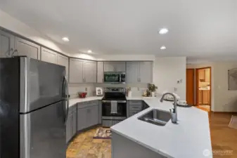 Beautiful updated kitchen with new cabinets, countertops and updated appliances.