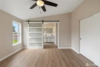 Primary bedroom looking toward the updated 3/4 bathroom