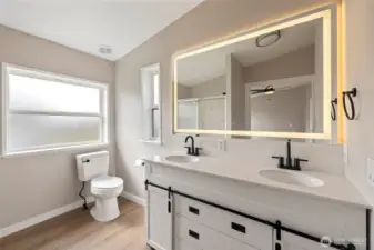 Updated 3/4 bathroom with lit LED mirror and new vanity