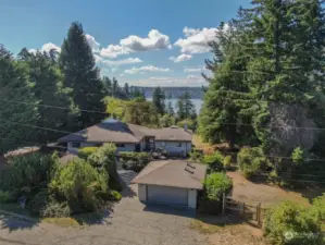 Tastefully nestled in the quiet north end of Vashon Island sits this light filled 3-bedroom single level home