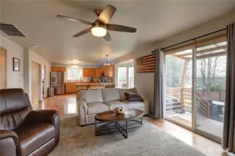 There is a small covered deck (on the right) leading to the backyard.