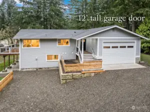 This home has it all, even a 12 ft garage door for the attached garage. NICE, for that tall truck or trailer.