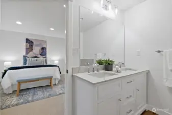 The primary bath has a double vanity,