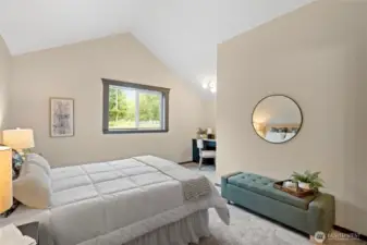 Primary bedroom 2 offers vaulted ceilings, tons of space, and a study nook.