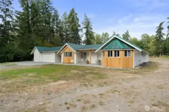 The front of the property offers ample parking options including the 3 car detached garage that is connected to the home via breezeway.