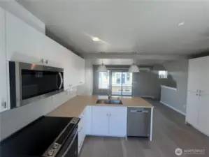Bright and open floor plan with slider leading to spacious deck