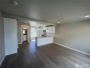 Door to left of kitchen leads to powder room
