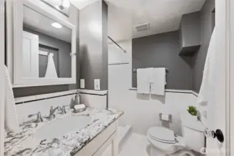 Updated, lovely 3/4 bath downstairs w/tile everywhere
