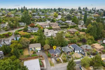 Looking west, this well-established neighborhood is full of established trees, charming homes yet still close to downtown Columbia City