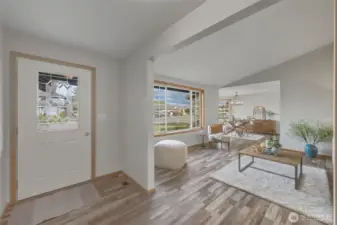 As you enter, you are welcomed into a light and bright living room with vaulted ceilings. LVP flooring throughout!