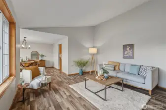 Just through the living room is an elegant dining space full of natural light.