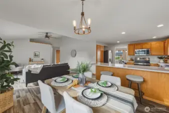 You'll enjoy meals with lots of natural light here thanks to its southern exposure! Beyond is the family room.