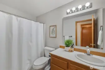 Full bathroom - across the hall from the laundry room.