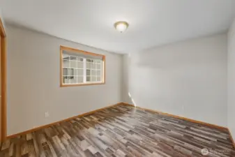 Another view of bedroom #3. This home has LVP flooring throughout.