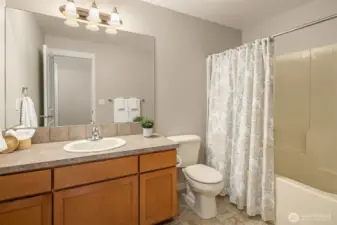 Upstairs bathroom with tub