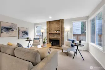 Family room has a wood burning fireplace.