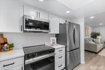 Quartz counters, upscale cabinetry, brand new stainless appliances,