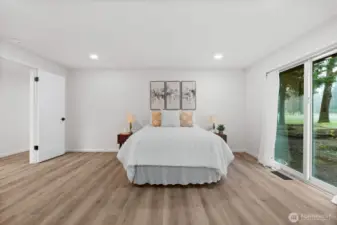 Primary suite with sliding door to the patio