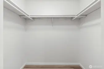Primary bedroom walk-in closet