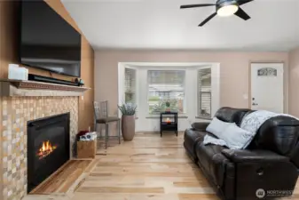 Bright and airy entry with high, vaulted ceilings and large bay window.