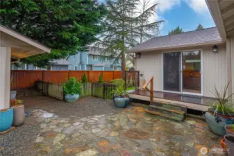 This home is a gardener's paradise: come discover the private slate patio.