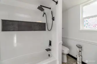 Redone tub and shower with unique finishes