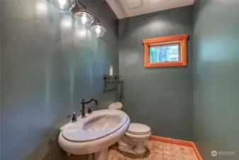 A powder room is conveniently off to the side.