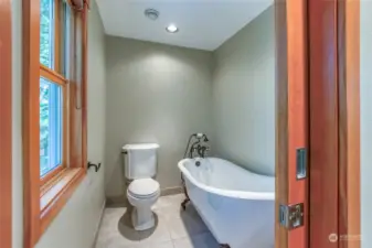 Soak in the tub in privacy while you enjoy the forest view.