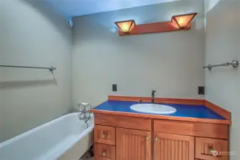 A full bath is located across the hall from the two lower bedrooms.