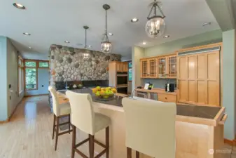 Beautiful finishes in the kitchen including soapstone countertops, a new double over and a Sub-Zero refrigerator. (Virtual Staging).