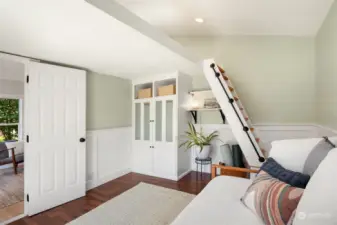 Stairs lead to loft bed