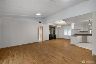 Your large, open-concept living room, dining room, kitchen combo awaits! Note the newly installed skylight suntunnels which brighten up the space!