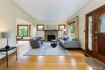 Living room features gas-burning fireplace.