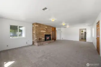 Beautiful stone fireplace will keep you cozy in winter.
