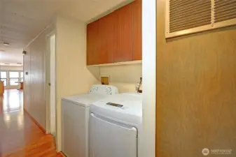Hallway storage and laundry space.