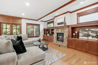 Cozy up by the fireplace in the open-concept great room with built-ins and casual dining—ideal for everyday living.
