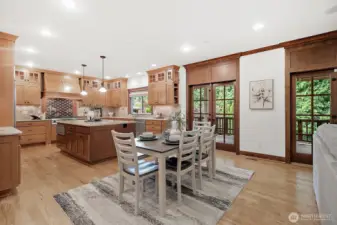 French doors open to a covered, heated deck—perfect for outdoor dining and relaxing in any season.