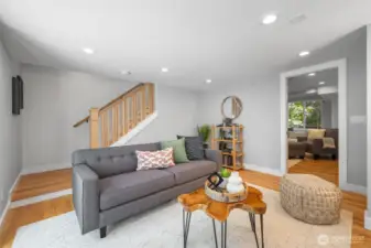 Lower level has been transformed, adding hardwood floors and creating an entire suite on the lower level with 2 bedrooms, full bath, storage and studio-work out space.