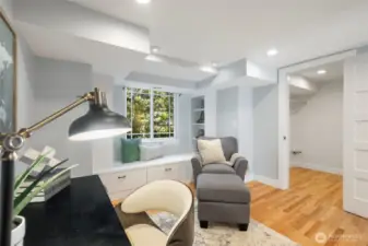 The 4th bedroom downstairs has a reading bench, built-ins and a large walk-in closet. Great for an office, guest room or workout space.