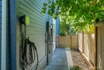 The home has a solar system- save 70% on bills that are only going up. Also comes with 2 large solar batteries. A large storage closet at the back of the house and the EV charger reaches the street for plug-in vehicles.