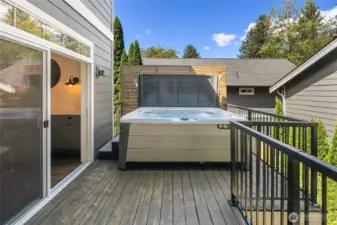 Back deck with hot tub and privacy screen